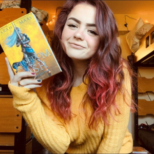 photo of Emma Clemons holding a book