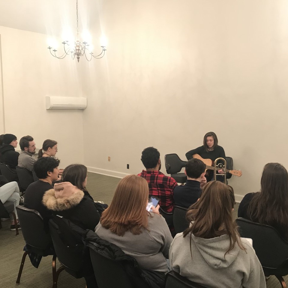 SSN member playing guitar at a talent show night at the Union